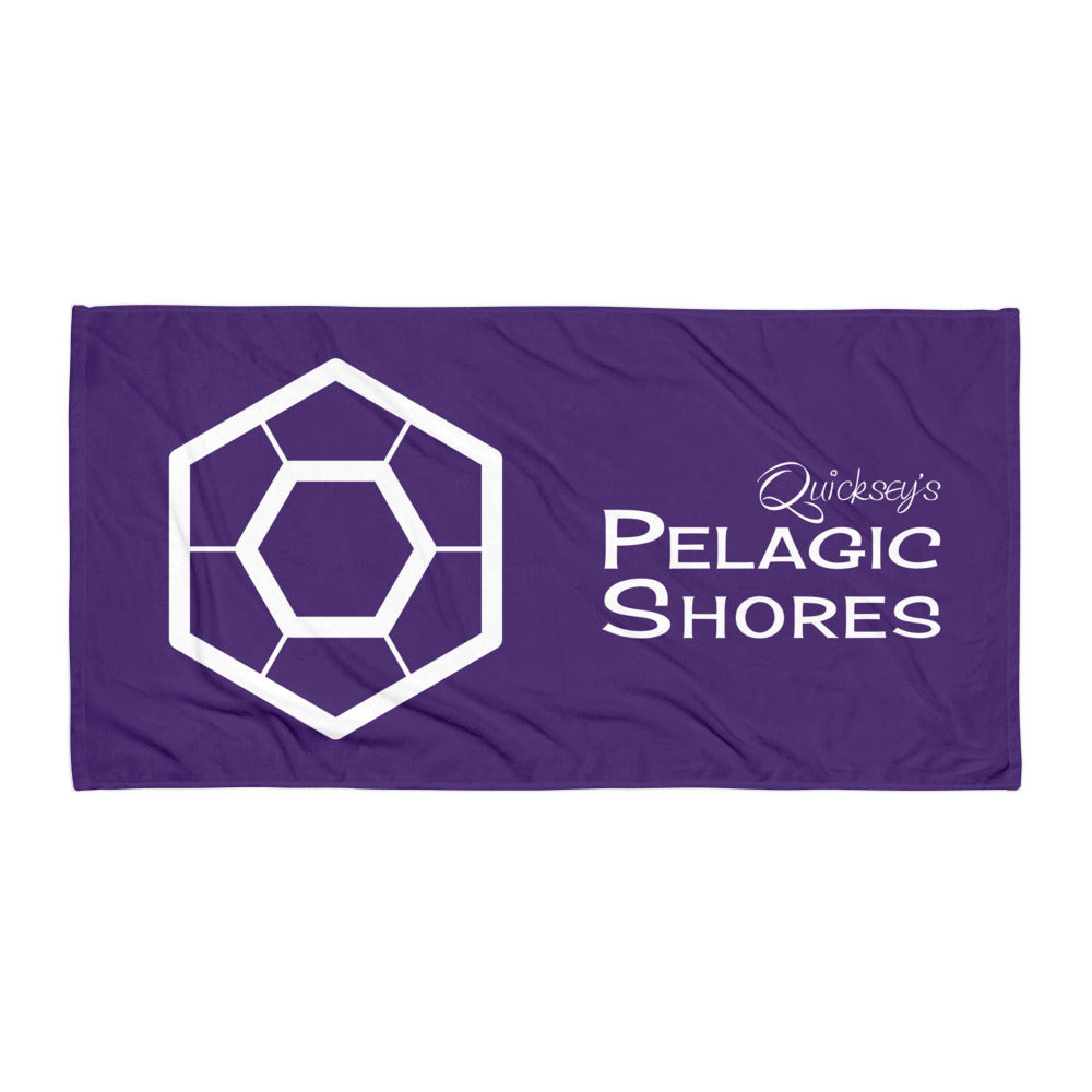 Purple towel with white logo and text that says ‘Quicksey’s Pelagic Shores'