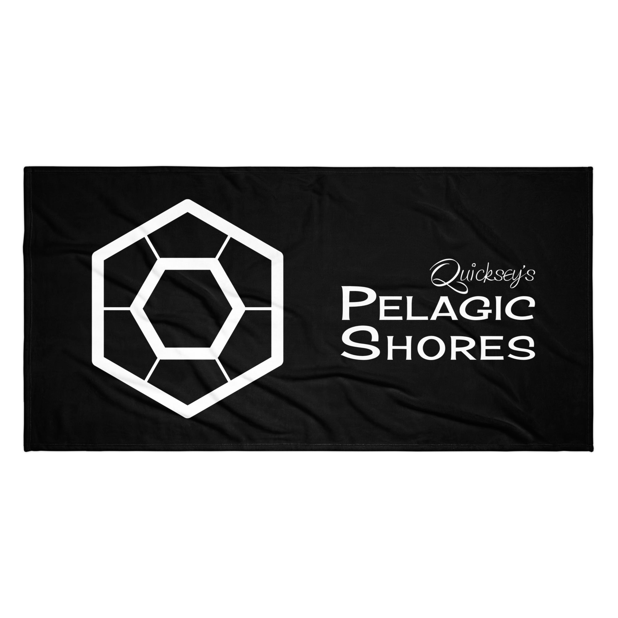 Black beach towel with white Pelagic Shores logo.