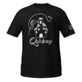 Black T-shirt depicting Coral Castle with the Quicksey logo beneath it. A small fairy-like creature is hovering and yelling and a line depicts the fairy’s flight path: crashing into the castle, spiraling, and flying over it.