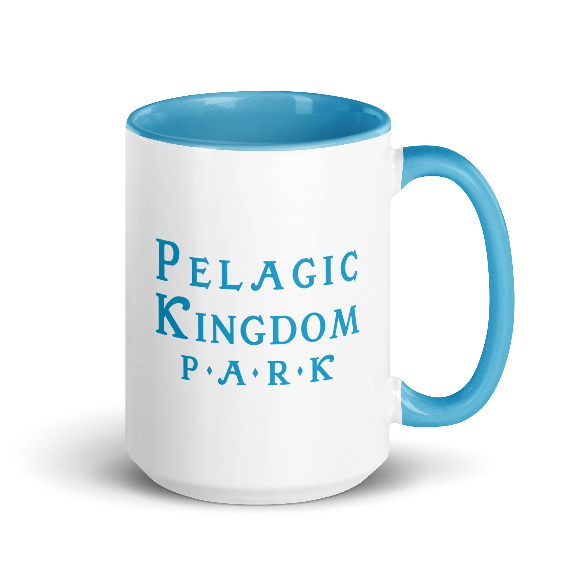 White ceramic mug with blue inside and blue handle and a blue Pelagic Kingdom Park logo on the outside.