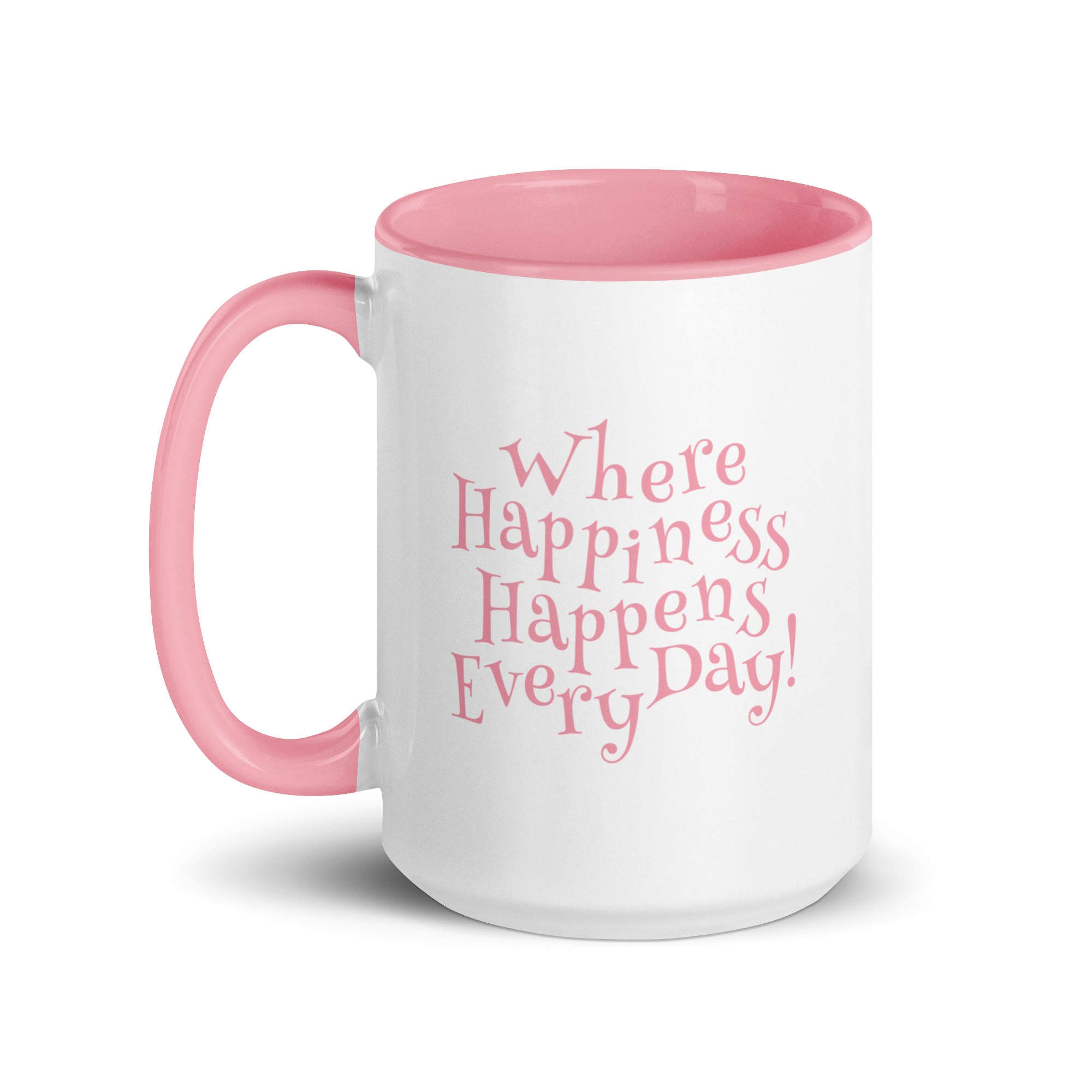 White ceramic mug with pink inside and pink handle and the phrase ‘Where Happiness Happens Every Day!’ in pink on the outside.