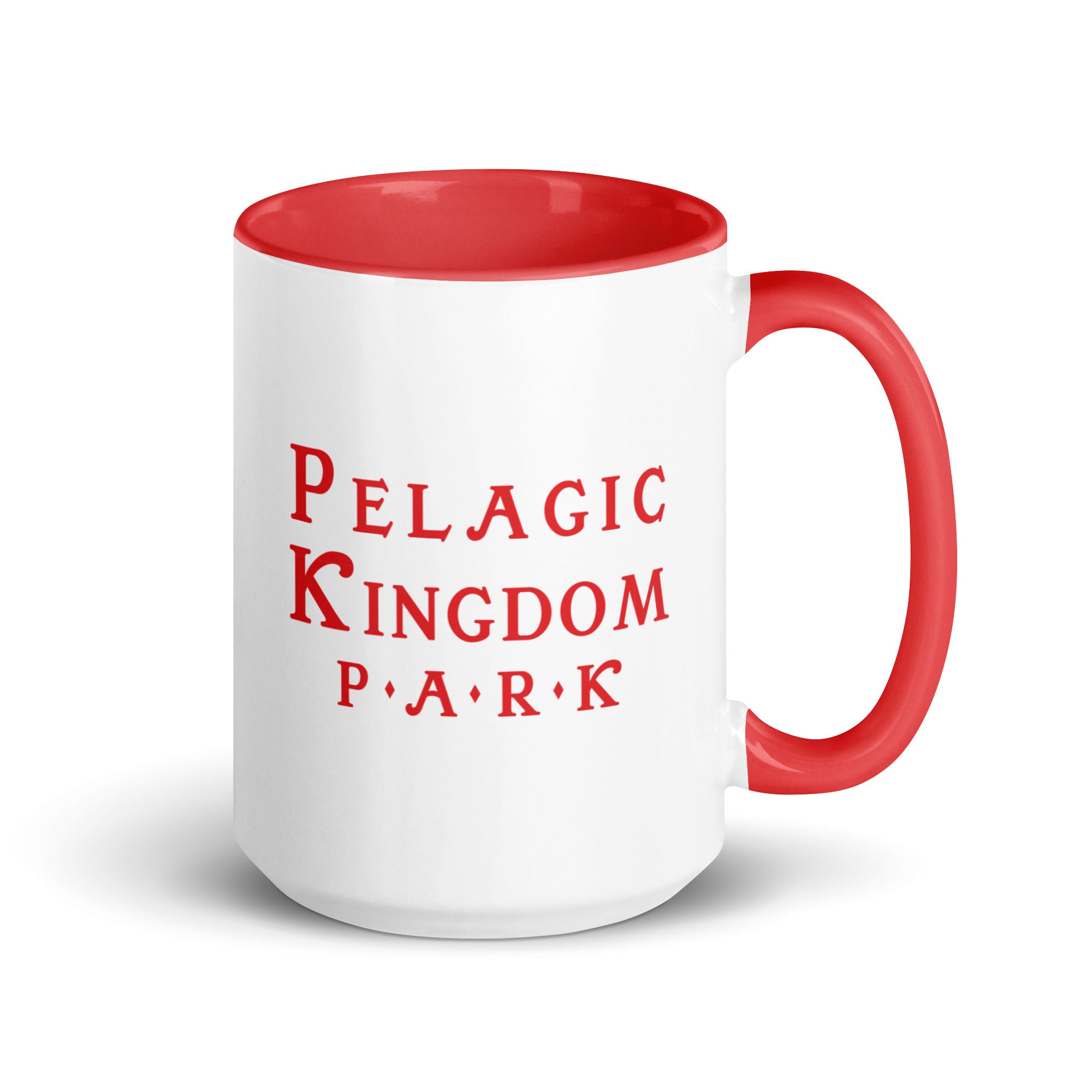 White ceramic mug with red inside and red handle and a black red Kingdom Park logo on the outside.